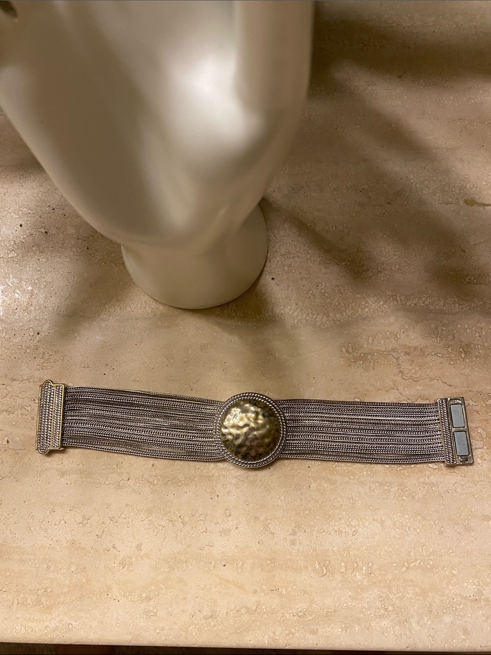 Silver-toned bracelet-magnetic clasp.